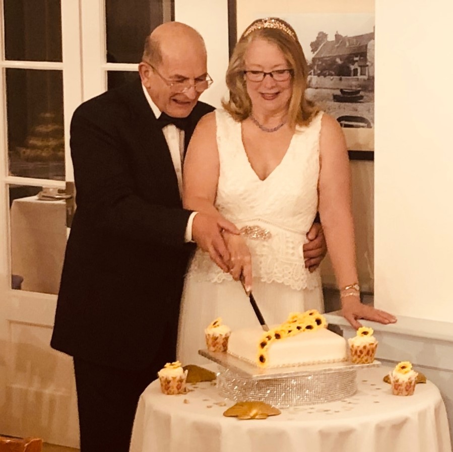 Beverley and Mike cutting cake